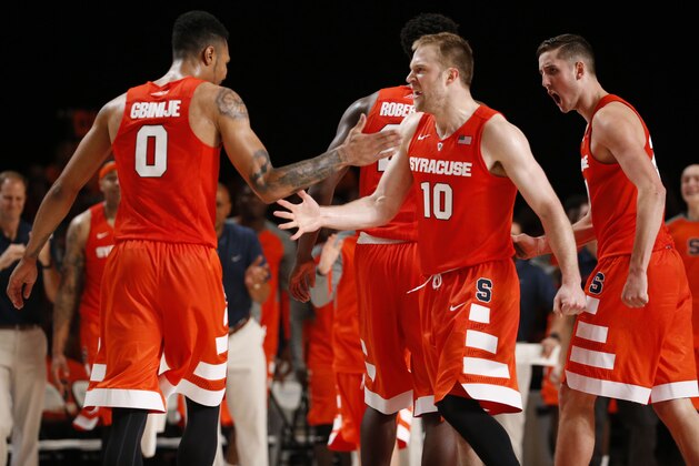 Nov 26, 2015; Paradise Island, BAHAMAS; Syracuse Orange forward Michael Gbinije (0) and guard Trevor Cooney (10) celebrate against the Connecticut Huskies in the second half during the 2015 Battle 4 Atlantis in the Imperial Arena at the Atlantis Resort.. Mandatory Credit: Kevin Jairaj-USA TODAY Sports