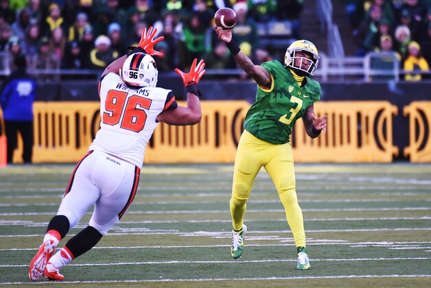 EUGENE, OR - NOVEMBER 27: Quarterback Vernon Adams Jr. #3 of the Oregon Ducks passes the ball as defensive end LaMone Williams #96 of the Oregon State Beavers during the second quarter of the game at Autzen Stadium on November 27, 2015 in Eugene, Oregon. (Photo by Steve Dykes/Getty Images)