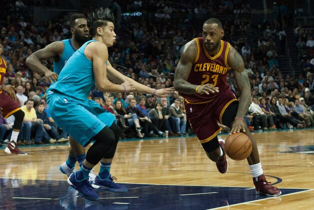 Nov 27, 2015; Charlotte, NC, USA; Cleveland Cavaliers forward LeBron James (23) dribbles the ball around Charlotte Hornets guard Jeremy Lin (7) during the first half at Time Warner Cable Arena. Mandatory Credit: Jeremy Brevard-USA TODAY Sports