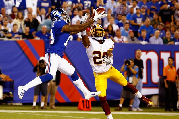 EAST RUTHERFORD, NJ - SEPTEMBER 24:  Odell Beckham #13 of the New York Giants scores a touchdown against Bashaud Breeland #26 of the Washington Redskins during their game at MetLife Stadium on September 24, 2015 in East Rutherford, New Jersey.  (Photo by Al Bello/Getty Images)