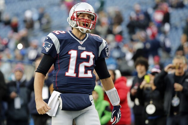 New England Patriots quarterback Tom Brady shouts as he runs onto the field before an NFL football game against the Denver Broncos on Sunday, Nov. 2, 2014, in Foxborough, Mass. (AP Photo/Elise Amendola)