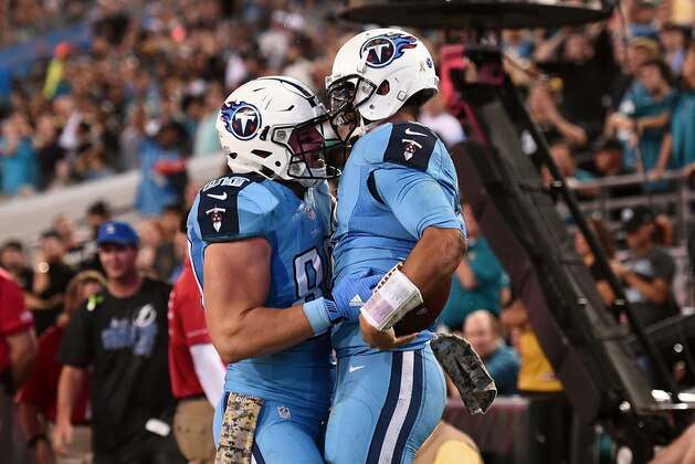 JACKSONVILLE, FL - NOVEMBER 19:  Phillip Supernaw #89 celebrates a touchdown with Marcus Mariota #8 of the Tennessee Titans during the third quarter of a game against the Jacksonville Jaguars at EverBank Field on November 19, 2015 in Jacksonville, Florida.  (Photo by Stacy Revere/Getty Images)