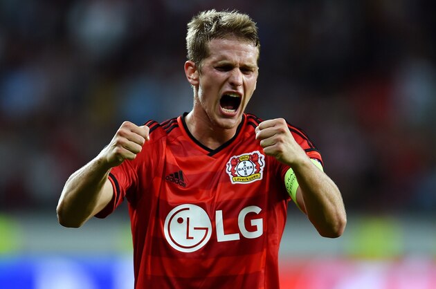Leverkusen's midfielder Lars Bender celebrates after the UEFA Champions League second leg playoff football match between Bayer Leverkusen and SS Lazio in Leverkusen, western Germany, on August 26, 2015.  Leverkusen wins 3-0. AFP PHOTO / PATRIK STOLLARZ        (Photo credit should read PATRIK STOLLARZ/AFP/Getty Images)