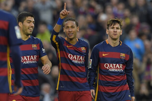 Barcelona's Brazilian forward Neymar (C) celebrates with Barcelona's Uruguayan forward Luis Suarez (L) and Barcelona's Argentinian forward Lionel Messi after scoring their third goal during the Spanish league football match FC Barcelona vs Real Sociedad de Futbol at the Camp Nou stadium in Barcelona on November 28, 2015. AFP PHOTO/ LLUIS GENE / AFP / LLUIS GENE        (Photo credit should read LLUIS GENE/AFP/Getty Images)