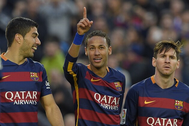Barcelona's Brazilian forward Neymar (C) celebrates with Barcelona's Uruguayan forward Luis Suarez (L) and Barcelona's Argentinian forward Lionel Messi after scoring their third goal during the Spanish league football match FC Barcelona vs Real Sociedad de Futbol at the Camp Nou stadium in Barcelona on November 28, 2015. AFP PHOTO/ LLUIS GENE / AFP / LLUIS GENE        (Photo credit should read LLUIS GENE/AFP/Getty Images)