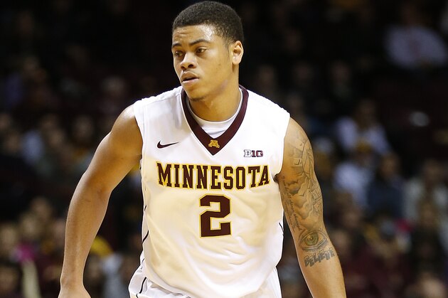 Minnesota guard Nate Mason (2) pushes the ball down the court in the second half of an NCAA college basketball game against Nebraska-Omaha on Friday, Nov. 27, 2015 at Williams Arena in Minneapolis. (AP Photo/Stacy Bengs)