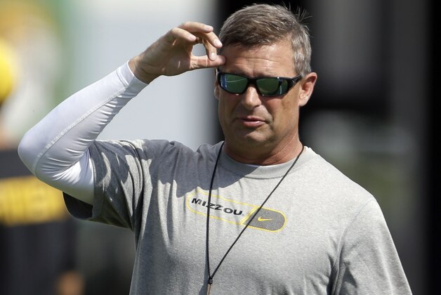 Missouri quarterbacks coach Andy Hill on the field during the team's first NCAA college football practice of the season Thursday, Aug. 1, 2013, in Columbia, Mo. (AP Photo/Jeff Roberson)
