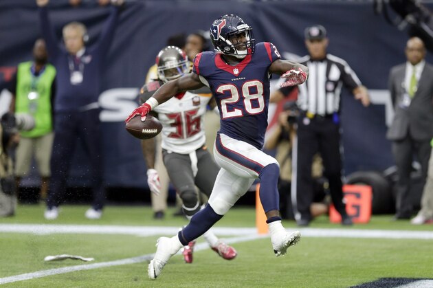 Houston Texans' Alfred Blue (28) rushes for a touchdown against the Tampa Bay Buccaneers during the second half of an NFL football game Sunday, Sept. 27, 2015, in Houston. (AP Photo/David J. Phillip)