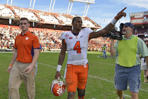 Clemson quarterback Deshaun Watson gestures to the fans after an NCAA college football game against South Carolina Saturday,  Nov. 28, 2015,  in Columbia,  S.C. Clemson won 37-32. (AP Photo/Richard Shiro)