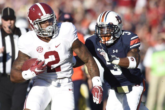 Nov 28, 2015; Auburn, AL, USA; Alabama Crimson Tide running back Derrick Henry (2) runs the ball as Auburn Tigers defensive back Jonathan Jones (3) during the first quarter at Jordan Hare Stadium. Mandatory Credit: Shanna Lockwood-USA TODAY Sports