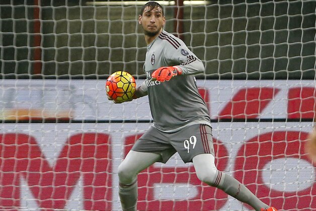AC Milan goalkeeper Gianluigi Donnarumma gets the ball during the Serie A soccer match between AC Milan and Chievo at the San Siro stadium in Milan, Italy, Wednesday, Oct. 28, 2015. (AP Photo/Antonio Calanni)