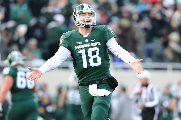 EAST LANSING, MI - NOVEMBER 28:  Connor Cook #18 of the Michigan State Spartans celebrates after throwing a touchdown pass in the first quarter at Spartan Stadium  on November 28, 2015 in East Lansing, Michigan. (Photo by Rey Del Rio/Getty Images)