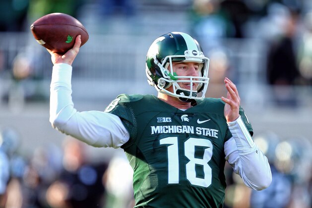 Nov 28, 2015; East Lansing, MI, USA; Michigan State Spartans quarterback Connor Cook (18) warms up prior to a game against the Penn State Nittany Lions at Spartan Stadium. Mandatory Credit: Mike Carter-USA TODAY Sports