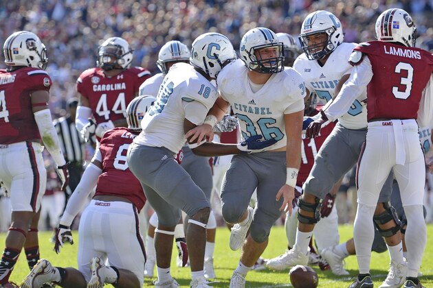 Citadel's Tyler Renew (36) celebrates with Cam Jackson after scoring a touchdown during the first half of an NCAA college football game Saturday, Nov. 21, 2015, in Columbia,  S.C. (AP Photo/Richard Shiro)