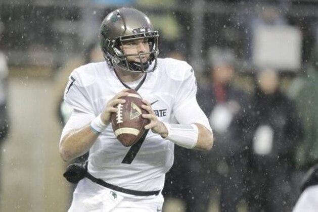 FILE - In this Nov. 21, 2015, file photo, Michigan State quarterback Tyler O'Connor plays against Ohio State during an NCAA college football game in Columbus, Ohio. Michigan State quarterback Connor Cook said after the Ohio State game he was having some pain in his right shoulder so we’ll see if he is ready to go against Penn State on Saturday.(AP Photo/Jay LaPrete, File)