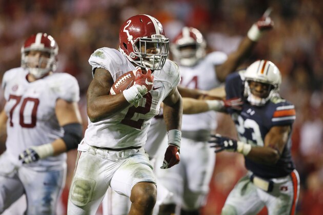Alabama running back Derrick Henry (2) scores a touchdown in the second half of an NCAA college football game against Auburn, Saturday, Nov. 28, 2015, in Auburn, Ala. Alabama won 29-13. (AP Photo/Gerald Herbert)