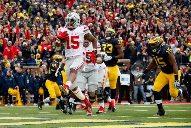 ANN ARBOR, MI - NOVEMBER 28:  Running back Ezekiel Elliott #15 of the Ohio State Buckeyes celebrates after rushing for a second quarter touchdown against the Michigan Wolverines at Michigan Stadium on November 28, 2015 in Ann Arbor, Michigan.  (Photo by Gregory Shamus/Getty Images)