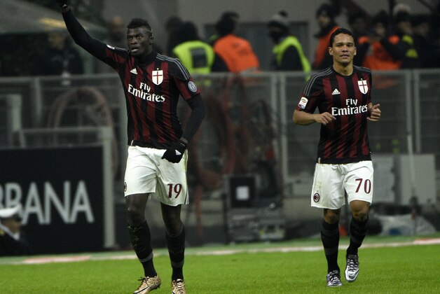 AC Milan's French forward Mbaye Niang celebrates (L) after scoring a goal during the Italian Serie A football match AC Milan vs Sampdoria on November 28, 2015 at the San Siro Stadium stadium in Milan. AFP PHOTO / OLIVIER MORIN / AFP / OLIVIER MORIN        (Photo credit should read OLIVIER MORIN/AFP/Getty Images)