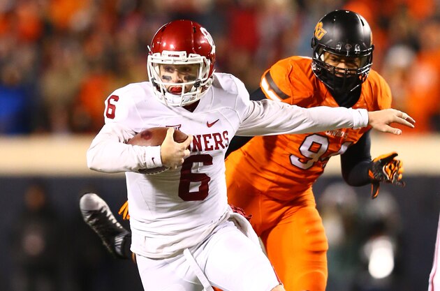 Nov 28, 2015; Stillwater, OK, USA; Oklahoma Sooners quarterback Baker Mayfield (6) runs the ball in the second quarter against the Oklahoma State Cowboys at Boone Pickens Stadium. Mandatory Credit: Mark J. Rebilas-USA TODAY Sports