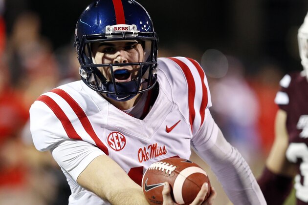 Mississippi quarterback Chad Kelly (10) lunges forward with the ball for a 27-yard touchdown run in the first half of an NCAA college football game against Mississippi State in Starkville, Miss., Saturday, Nov. 28, 2015. (AP Photo/Rogelio V. Solis)