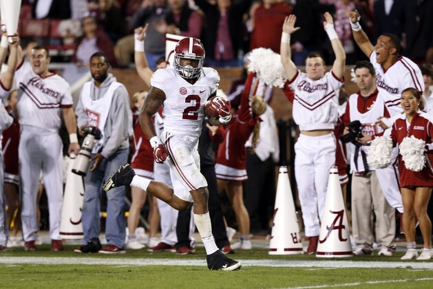 Cheerleaders signal a touchdown as Alabama running back Derrick Henry (2) sprints 65-yards against Mississippi State for a touchdown during the second half of an NCAA college football game in Starkville, Miss., Saturday, Nov. 14, 2015. (AP Photo/Rogelio V. Solis)