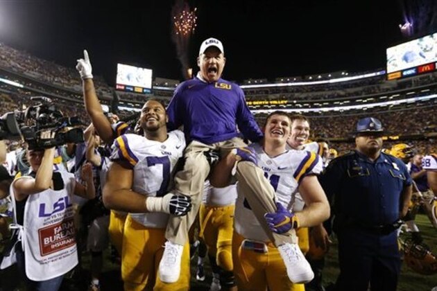 LSU head coach Les Miles is carried off the field after an NCAA college football game against Texas A&M in Baton Rouge, La., Saturday, Nov. 28, 2015. LSU won 19-7. (AP Photo/Jonathan Bachman)