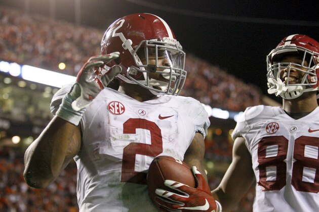 Nov 28, 2015; Auburn, AL, USA; Alabama Crimson Tide running back Derrick Henry (2) celebrates tight end O.J. Howard (88) after scoring a touchdown in the fourth quarter to beat the Auburn Tigers 29-13 Jordan Hare Stadium. Mandatory Credit: John Reed-USA TODAY Sports