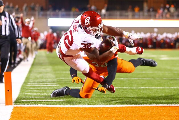 Nov 28, 2015; Stillwater, OK, USA; Oklahoma Sooners running back Samaje Perine dives into the end zone for a touchdown against the Oklahoma State Cowboys in the second quarter at Boone Pickens Stadium. Mandatory Credit: Mark J. Rebilas-USA TODAY Sports