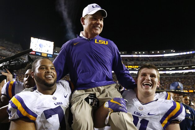 LSU head coach Les Miles is carried off the field after an NCAA college football game against Texas A&M in Baton Rouge, La., Saturday, Nov. 28, 2015. LSU won 19-7. (AP Photo/Jonathan Bachman)