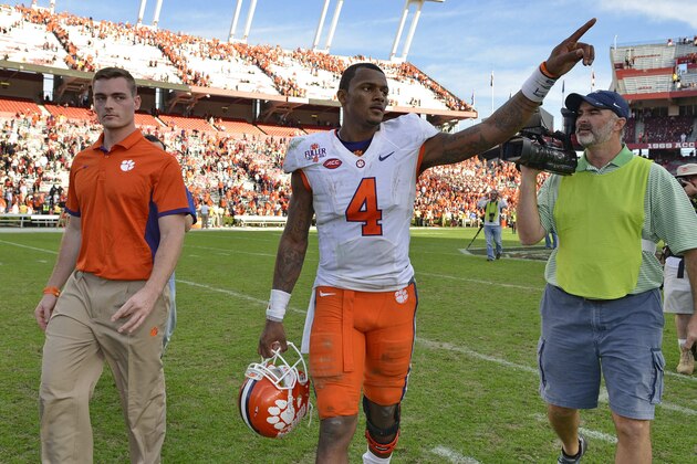 Clemson quarterback Deshaun Watson gestures to the fans after an NCAA college football game against South Carolina Saturday,  Nov. 28, 2015,  in Columbia,  S.C. Clemson won 37-32. (AP Photo/Richard Shiro)