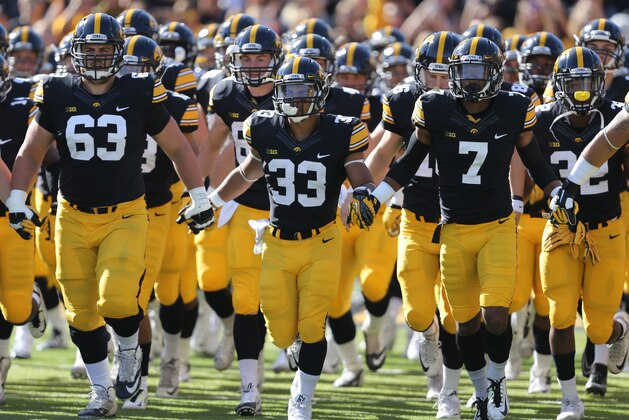 The Iowa Hawkeyes take the field before the start of an NCAA college football game against Illinois, Saturday, Oct. 10, 2015, in Iowa City, Iowa. (AP Photo/Justin Hayworth)