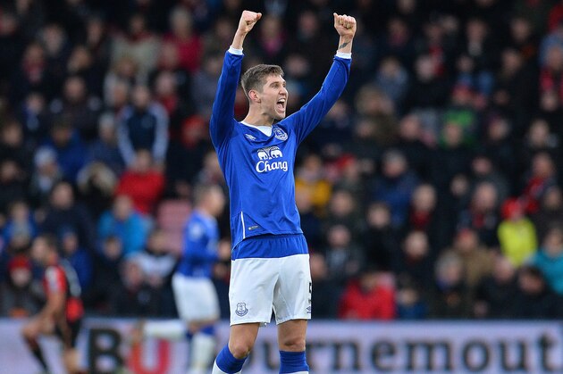 Everton's English defender John Stones celebrates after teammate Belgian striker Romelu Lukaku scored his team's second goal during the English Premier League football match between Bournemouth and Everton at the Vitality Stadium in Bournemouth, southern England on November 28, 2015.    AFP PHOTO / GLYN KIRK

RESTRICTED TO EDITORIAL USE. No use with unauthorized audio, video, data, fixture lists, club/league logos or 'live' services. Online in-match use limited to 75 images, no video emulation. No use in betting, games or single club/league/player publications. / AFP / GLYN KIRK        (Photo credit should read GLYN KIRK/AFP/Getty Images)