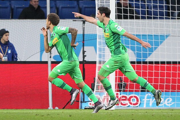 Moenchengladbach's US defender Fabian Johnson (L) celebrates scoring the 3-3 during the German first division Bundesliga football match TSG 1899 Hoffenheim vs Borussia Moenchengladbach in Sinsheim, southern Germany, on November 28, 2015.  AFP PHOTO / DANIEL ROLAND

RESTRICTIONS: DURING MATCH TIME: DFL RULES TO LIMIT THE ONLINE USAGE TO 15 PICTURES PER MATCH AND FORBID IMAGE SEQUENCES TO SIMULATE VIDEO. 
==RESTRICTED TO EDITORIAL USE ==
FOR FURTHER QUERIES PLEASE CONTACT THE DFL DIRECTLY AT + 49 69 650050. / AFP / DANIEL ROLAND        (Photo credit should read DANIEL ROLAND/AFP/Getty Images)