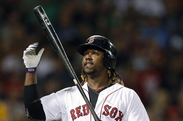 Boston Red Sox's Hanley Ramirez tosses his bat after lining out during the sixth inning of a baseball game against the Kansas City Royals in Boston, Saturday, Aug. 22, 2015. (AP Photo/Michael Dwyer)