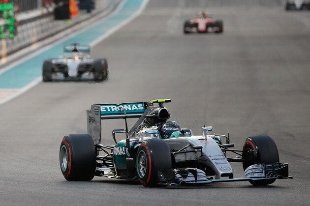 Mercedes driver Nico Rosberg of Germany leads his teammate Lewis Hamilton of Britain andd Ferrari driver Kimi Raikkonen of Finland during the Emirates Formula One Grand Prix at the Yas Marina racetrack in Abu Dhabi, United Arab Emirates, Sunday, Nov. 29, 2015. (AP Photo/Luca Bruno)