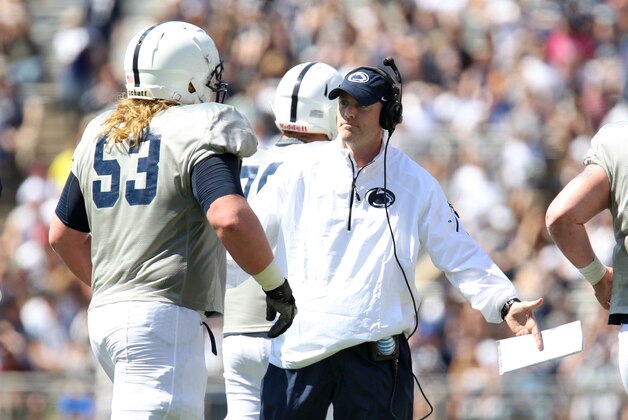 Apr 12, 2014; State College, PA, USA; Penn State Nittany Lions offensive coordinator/tight ends coach John Donovan high-fives guard Derek Dowrey (53) in the second quarter of the Blue White spring game at Beaver Stadium. The Blue team defeated the White team 37-0. Mandatory Credit: Matthew O'Haren-USA TODAY Sports