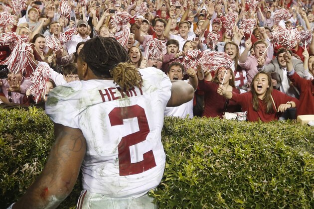 Fans cheer for Alabama running back Derrick Henry (2) after an NCAA college football game, Saturday, Nov. 28, 2015, in Auburn, Ala. Alabama won 29-13. (AP Photo/Gerald Herbert)