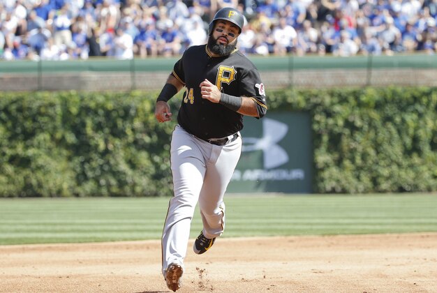 Sep 26, 2015; Chicago, IL, USA; Pittsburgh Pirates first baseman Pedro Alvarez (24) rounds the bases after Pittsburgh Pirates shortstop Jordy Mercer (not pictured) hit a three run home run against the Chicago Cubs during the fifth inning at Wrigley Field. Mandatory Credit: Kamil Krzaczynski-USA TODAY Sports