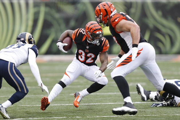 Cincinnati Bengals running back Jeremy Hill (32) runs the ball in the first half of an NFL football game against the St. Louis Rams, Sunday, Nov. 29, 2015, in Cincinnati. (AP Photo/Frank Victores)