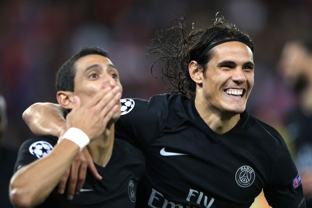 PSG's Angel Di Maria, left, and PSG's Edinson Cavani react after di Maria scored the opening goal during the Champions League Group A soccer match between PSG and Malmo at the Parc des Princes stadium in Paris, France, Tuesday, Sept. 15, 2015. (AP Photo/Francois Mori)