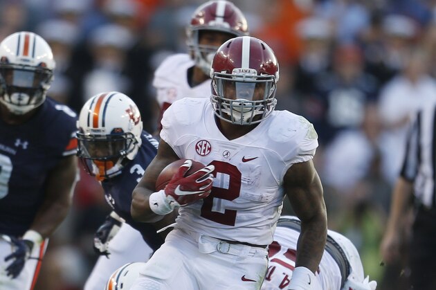 Alabama running back Derrick Henry (2) runs the ball during an NCAA college football game against Alabama, Saturday, Nov. 28, 2015, in Auburn, Ala. (AP Photo/Butch Dill)