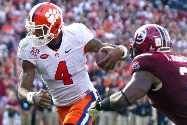 Nov 28, 2015; Columbia, SC, USA;  Clemson Tigers quarterback Deshaun Watson (4) carries for a touchdown during the second half against the South Carolina Gamecocks at Williams-Brice Stadium. Mandatory Credit: Joshua S. Kelly-USA TODAY Sports