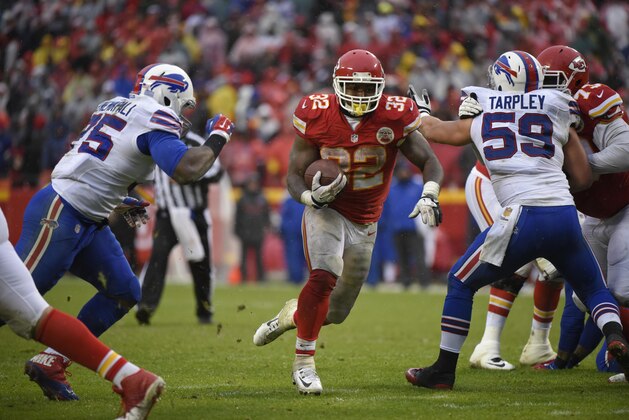 Kansas City Chiefs running back Spencer Ware (32) carries the ball during the second half of an NFL football game against the Buffalo Bills in Kansas City, Mo., Sunday, Nov. 29, 2015. (AP Photo/Ed Zurga)