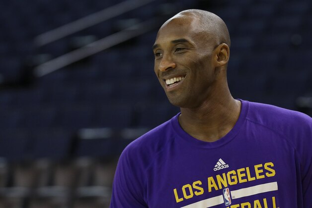 Los Angeles Lakers guard Kobe Bryant warms up before an NBA basketball game against the Golden State Warriors in Oakland, Calif., Tuesday, Nov. 24, 2015. (AP Photo/Jeff Chiu)