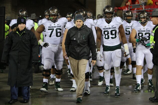 COLUMBUS, OH - NOVEMBER 21: Head coach Mark Dantonio of the Michigan State Spartans leads his team onto the field before the start of the third quarter against the Ohio State Buckeyes at Ohio Stadium on November 21, 2015 in Columbus, Ohio. (Photo by Rey Del Rio/Getty Images)