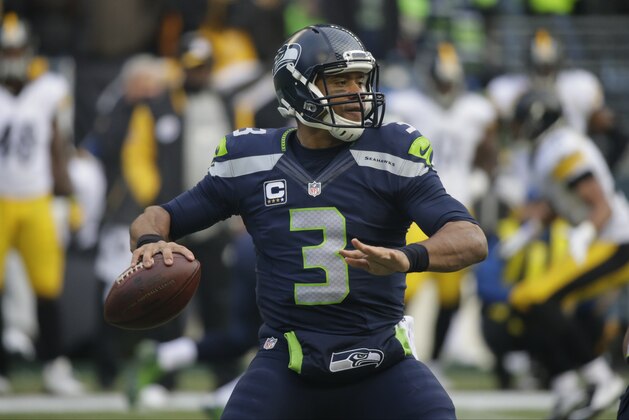 Seattle Seahawks quarterback Russell Wilson throws against the Pittsburgh Steelers in the first half of an NFL football game, Sunday, Nov. 29, 2015, in Seattle. (AP Photo/Ted S. Warren)