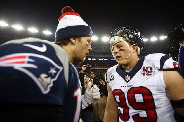 FOXBORO, MA - JANUARY 13:  Tom Brady #12 of the New England Patriots greets J.J. Watt #99 of the Houston Texans after the 2013 AFC Divisional Playoffs game at Gillette Stadium on January 13, 2013 in Foxboro, Massachusetts.  (Photo by Elsa/Getty Images)