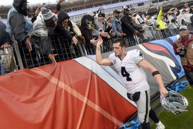 Oakland Raiders quarterback Derek Carr leaves the field after beating the Tennessee Titans 24-21in an NFL football game Sunday, Nov. 29, 2015, in Nashville, Tenn. (AP Photo/Mark Zaleski)