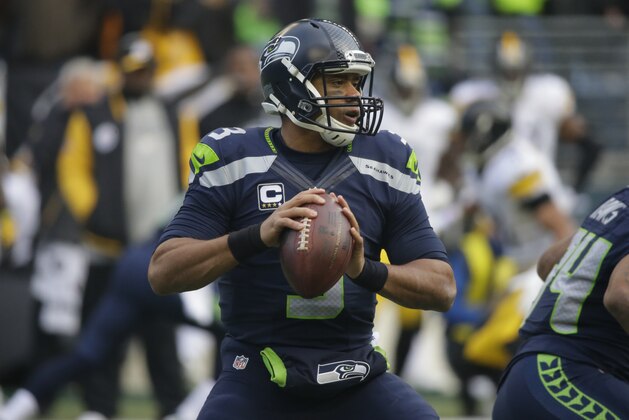 Seattle Seahawks quarterback Russell Wilson throws against the Pittsburgh Steelers in the first half of an NFL football game, Sunday, Nov. 29, 2015, in Seattle. (AP Photo/Ted S. Warren)