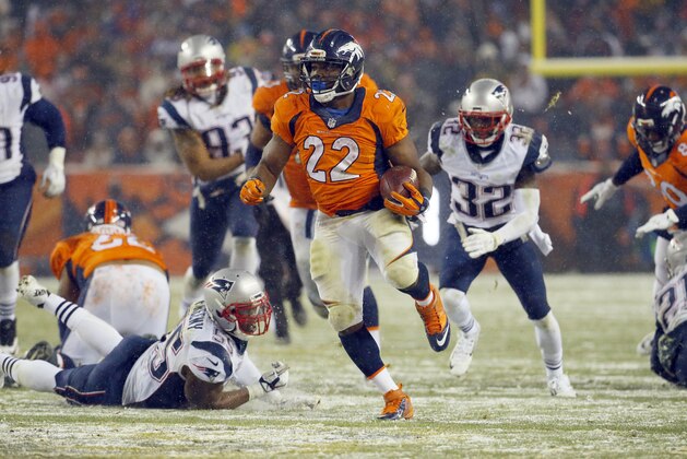 Denver Broncos running back C.J. Anderson (22) breaks free for the game-winning touchdown against the New England Patriots during overtime of an NFL football game, Sunday, Nov. 29, 2015, in Denver. The Broncos defeated the Patriots 30-24. (AP Photo/Jack Dempsey)